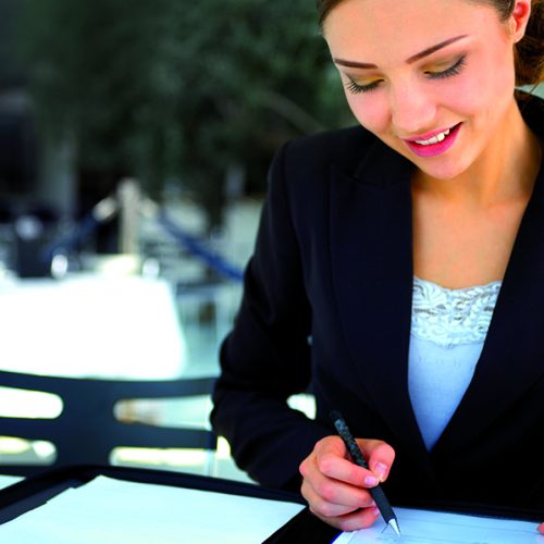 Businesswoman reviewing details in a cafe